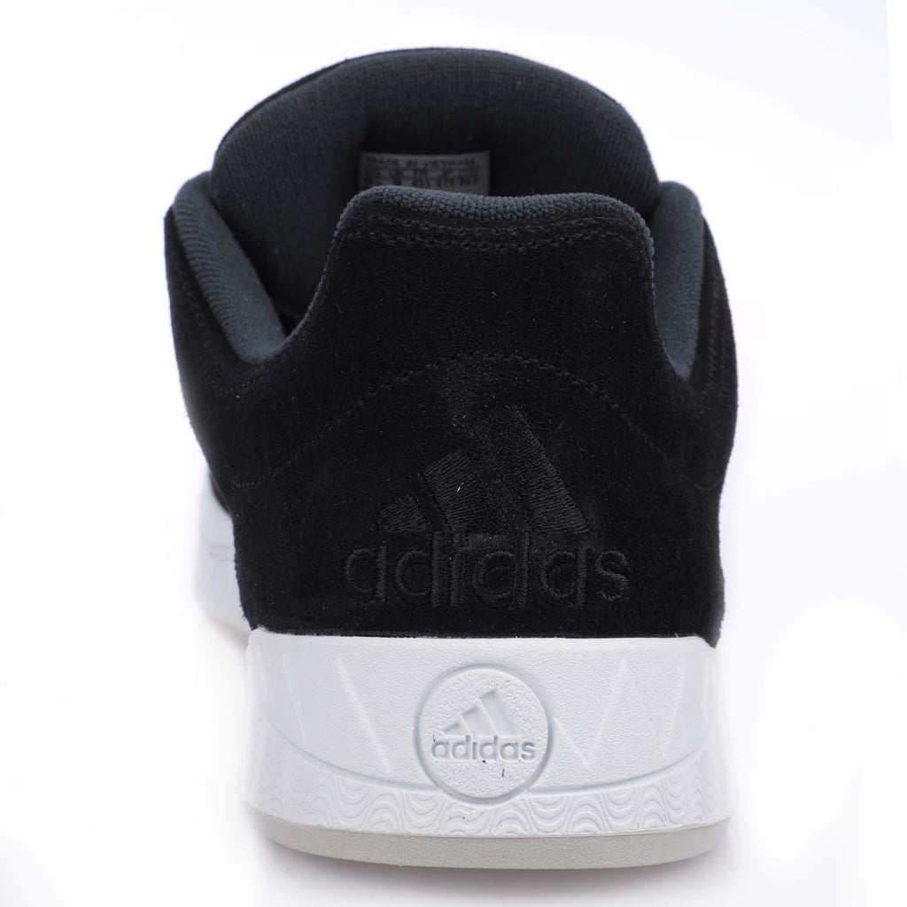 Back view of black adidas Originals Adimatic trainers with embossed adidas on heel and white sole