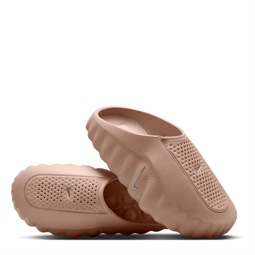 Beige Nike slide sandals with perforated upper and molded traction sole