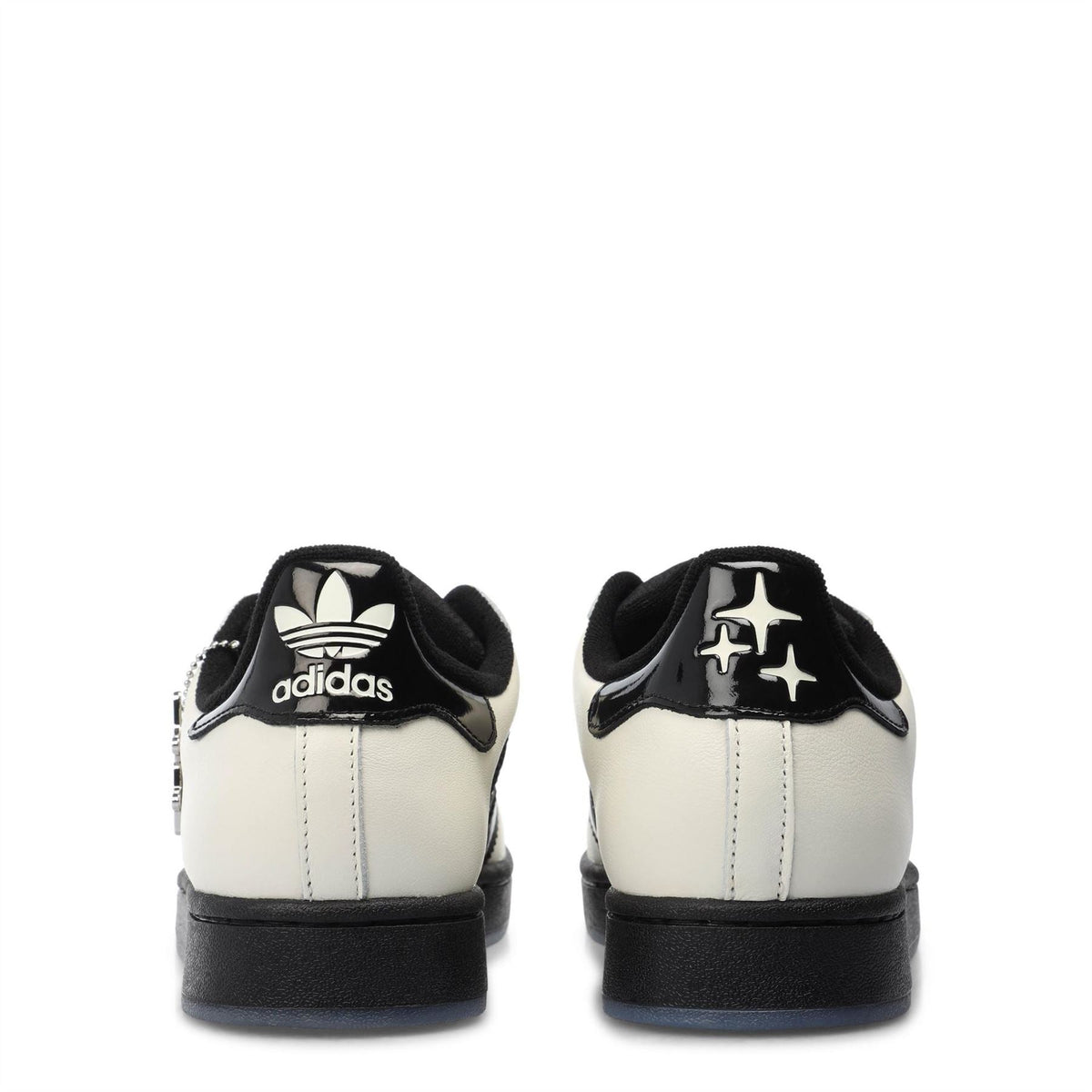 Back view of off-white trainers with adidas logo on heels and black heel tabs
