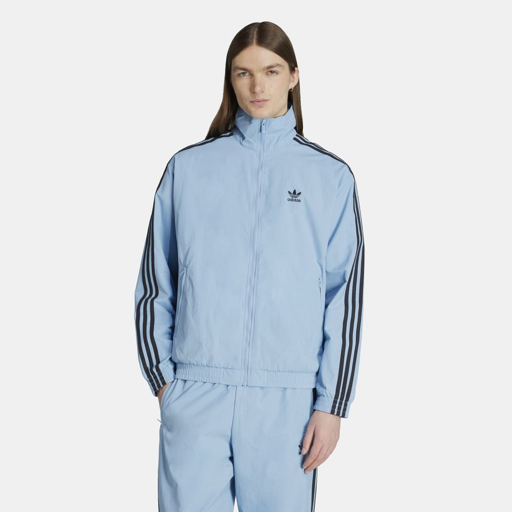 Light blue adidas Originals track top with full-zip front and triple black sleeve stripes