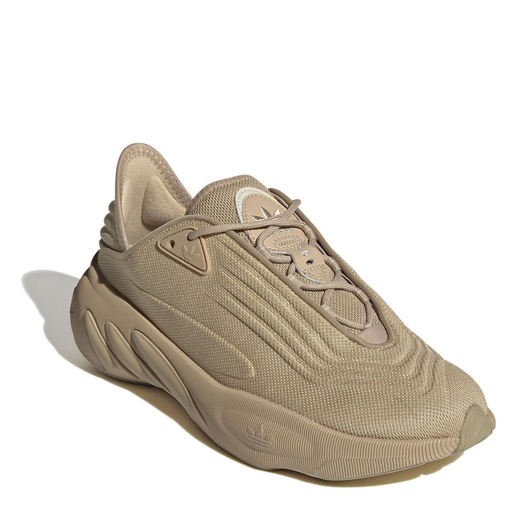 Beige lace-up low-top trainers with mesh texture and sculpted midsole