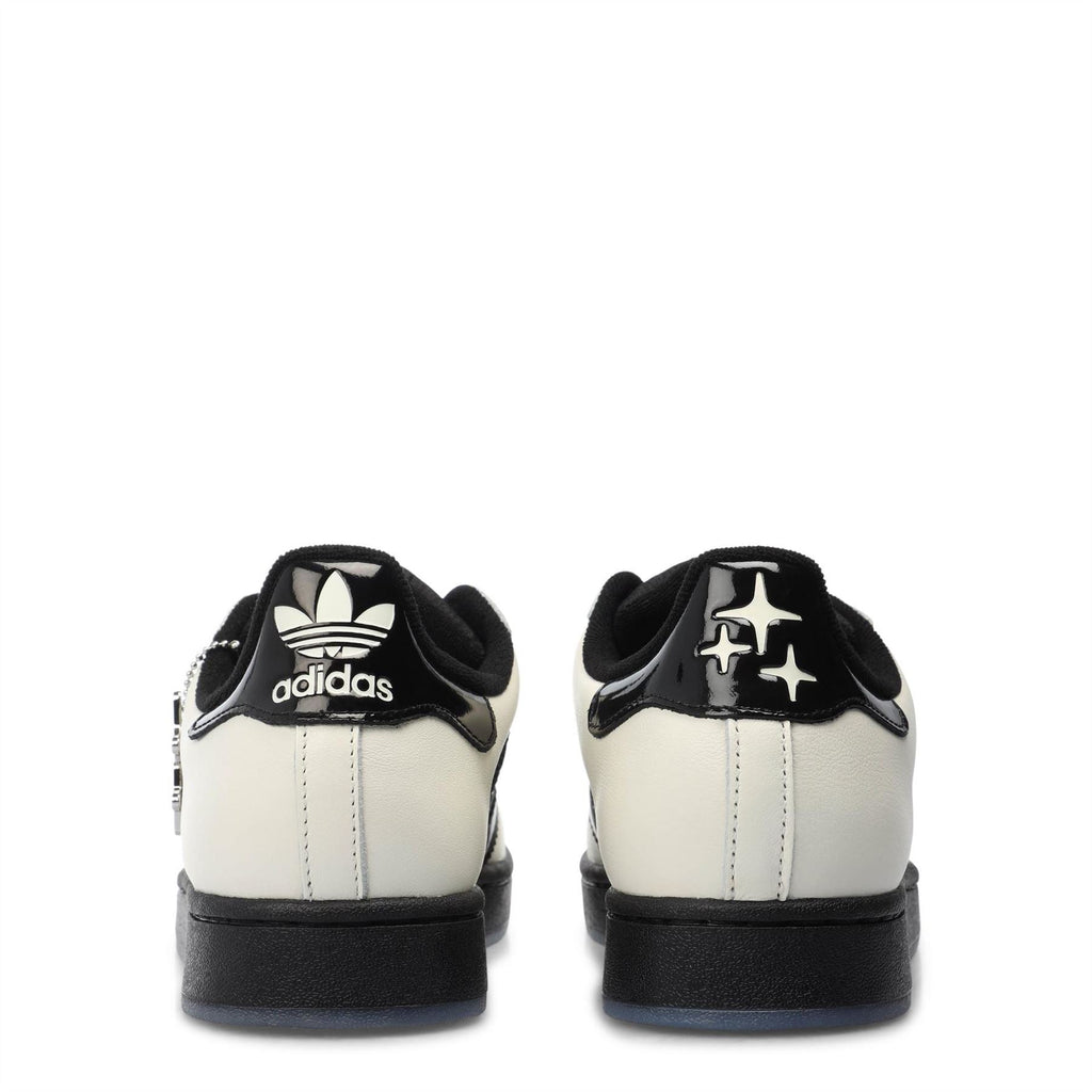 adidas low-top sneakers, off-white with black heel tab and adidas trefoil logo