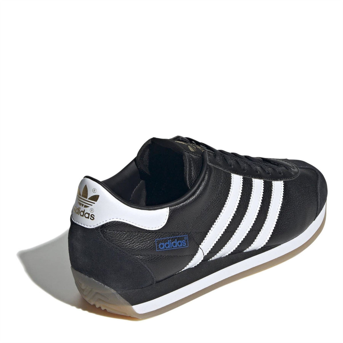 Black low-top sneakers with white heel tab and triple stripes, lace-up style.