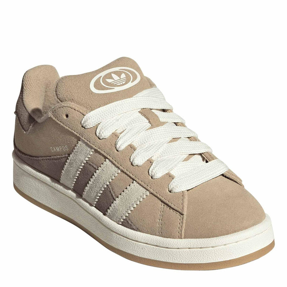 Tan suede low-top trainers with white laces and adidas-style logo on tongue