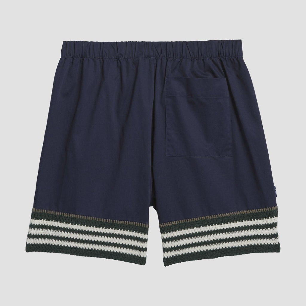 Indigo knit shorts back view with elastic waistband and striped hem