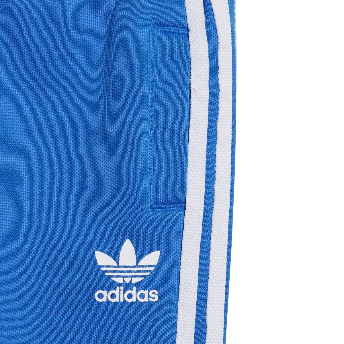 Infant blue jogger pants with white adidas logo and side stripe detail