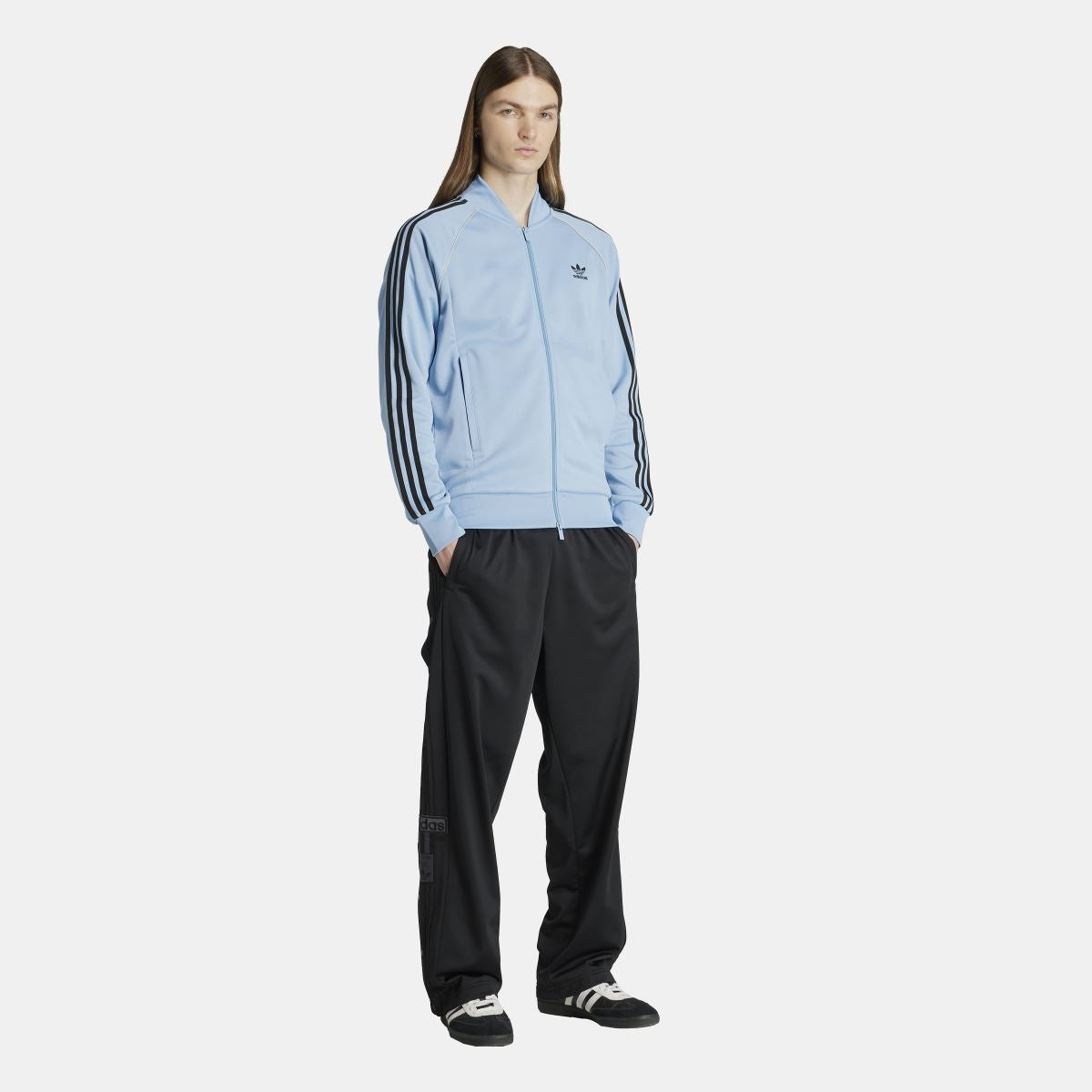 adidas Originals Adicolor Classic SST track jacket in black with white stripes, front view showing full jacket design.
