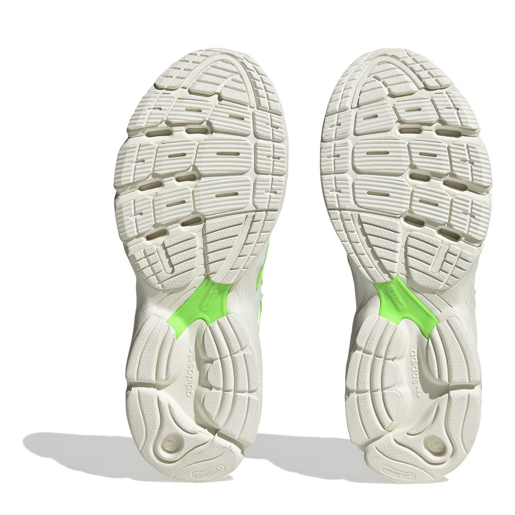Pair of white outsoles with deep tread and neon green heel insert