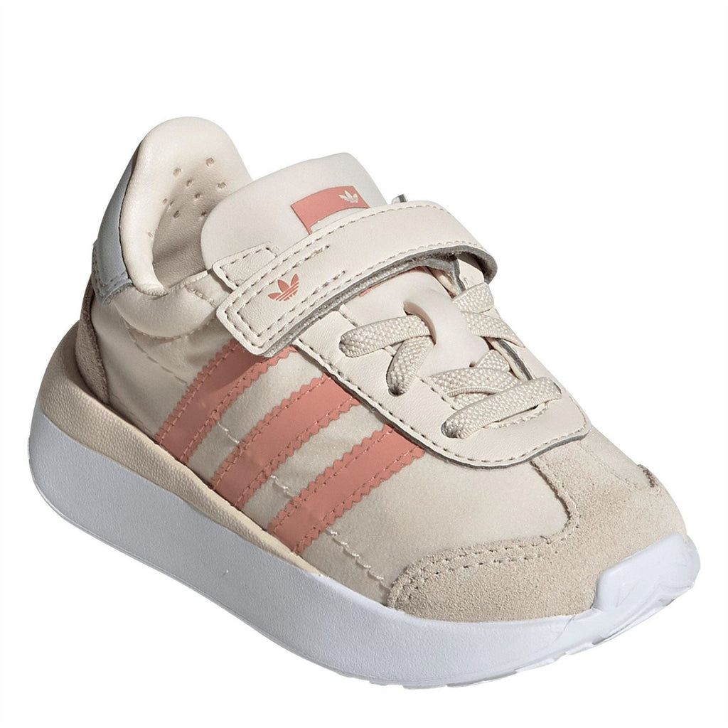 Off-white suede slip-on sneaker with hook-and-loop strap and coral side stripes