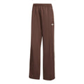 Brown adidas Originals track pants with white side stripes and trefoil logo