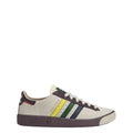 Cream low-top sneakers with navy, green and yellow stripes, brown sole
