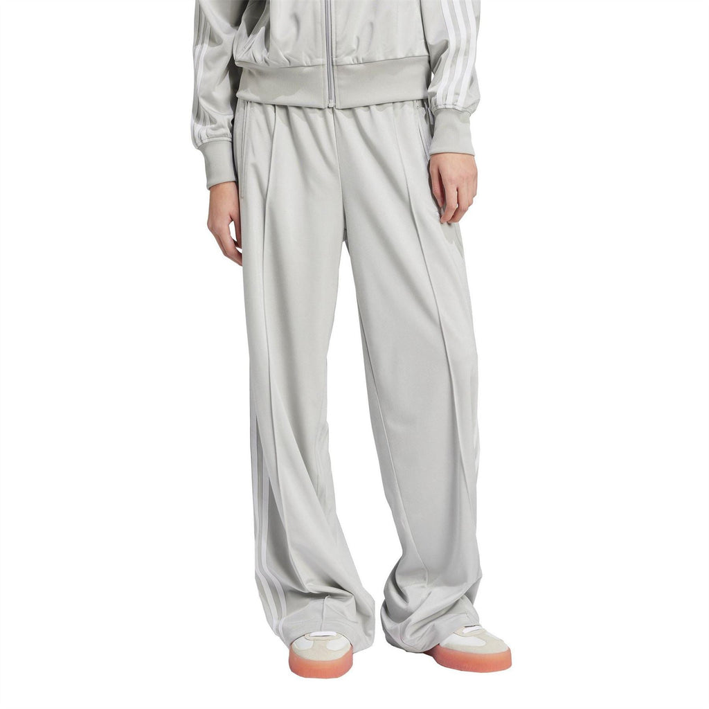 Grey adidas Originals track pants with drawstring waist and side seam stripes