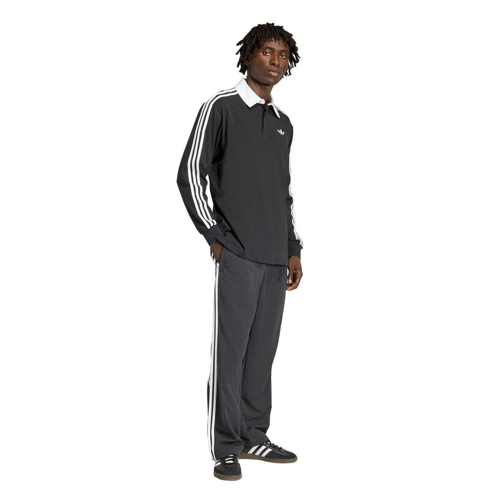 Black long-sleeve collared shirt with white triple stripes on sleeves and adidas logo