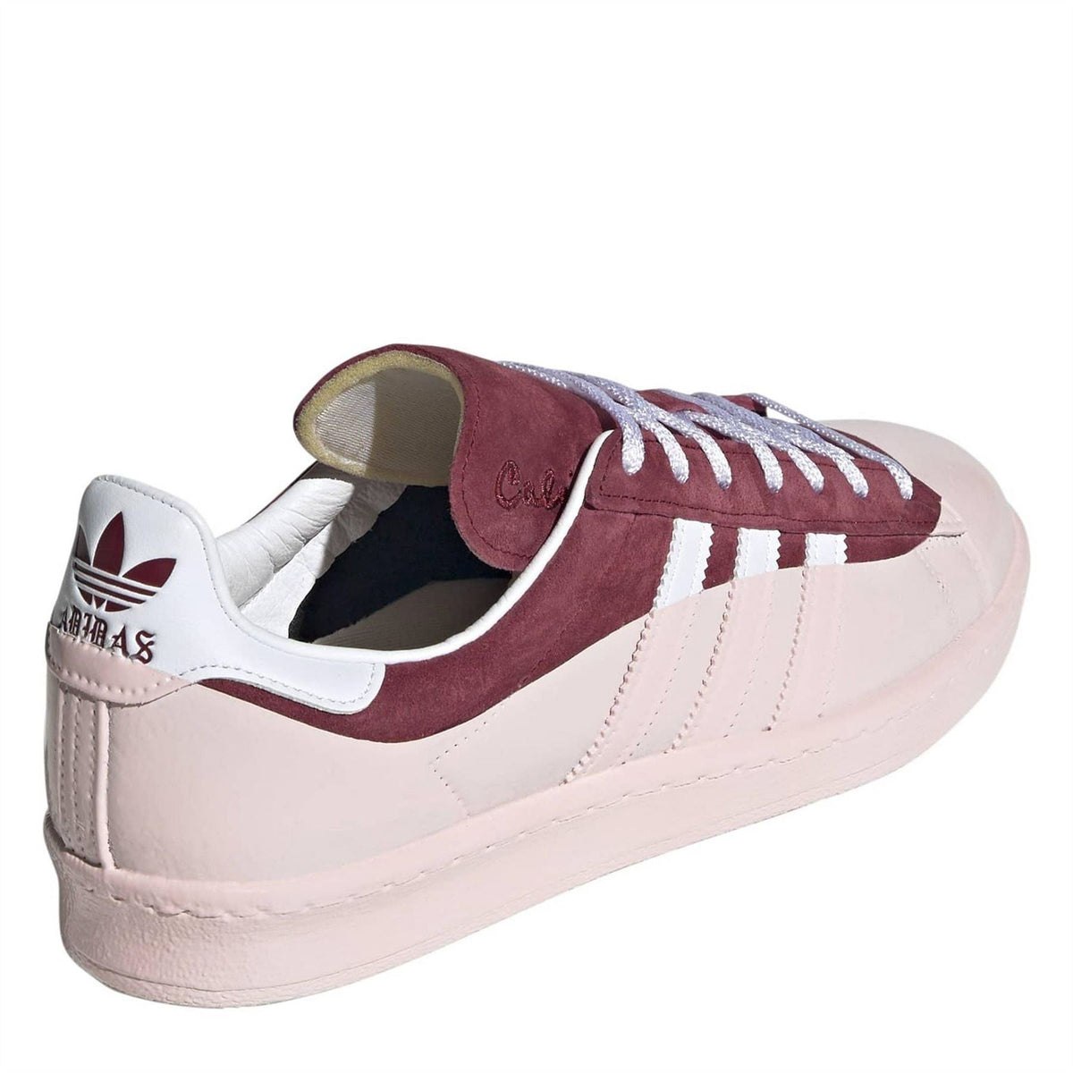 Low-top sneakers showing heel collar and padded lining, burgundy and off-white upper