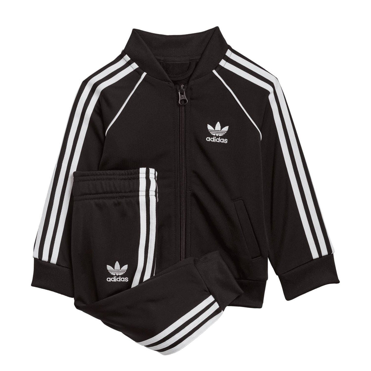 Infant black zip-up tracksuit jacket with white triple stripes, adidas logo, and matching pants