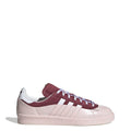 Off-white and burgundy low-top sneakers with white side stripes and lace-up closure