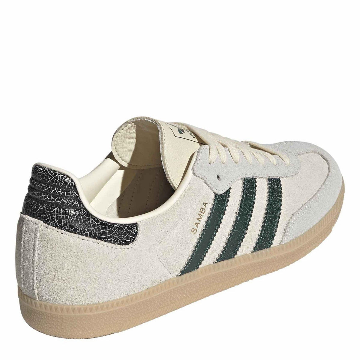Samba OG sneakers with light gray suede uppers, green stripes, and black heel panel