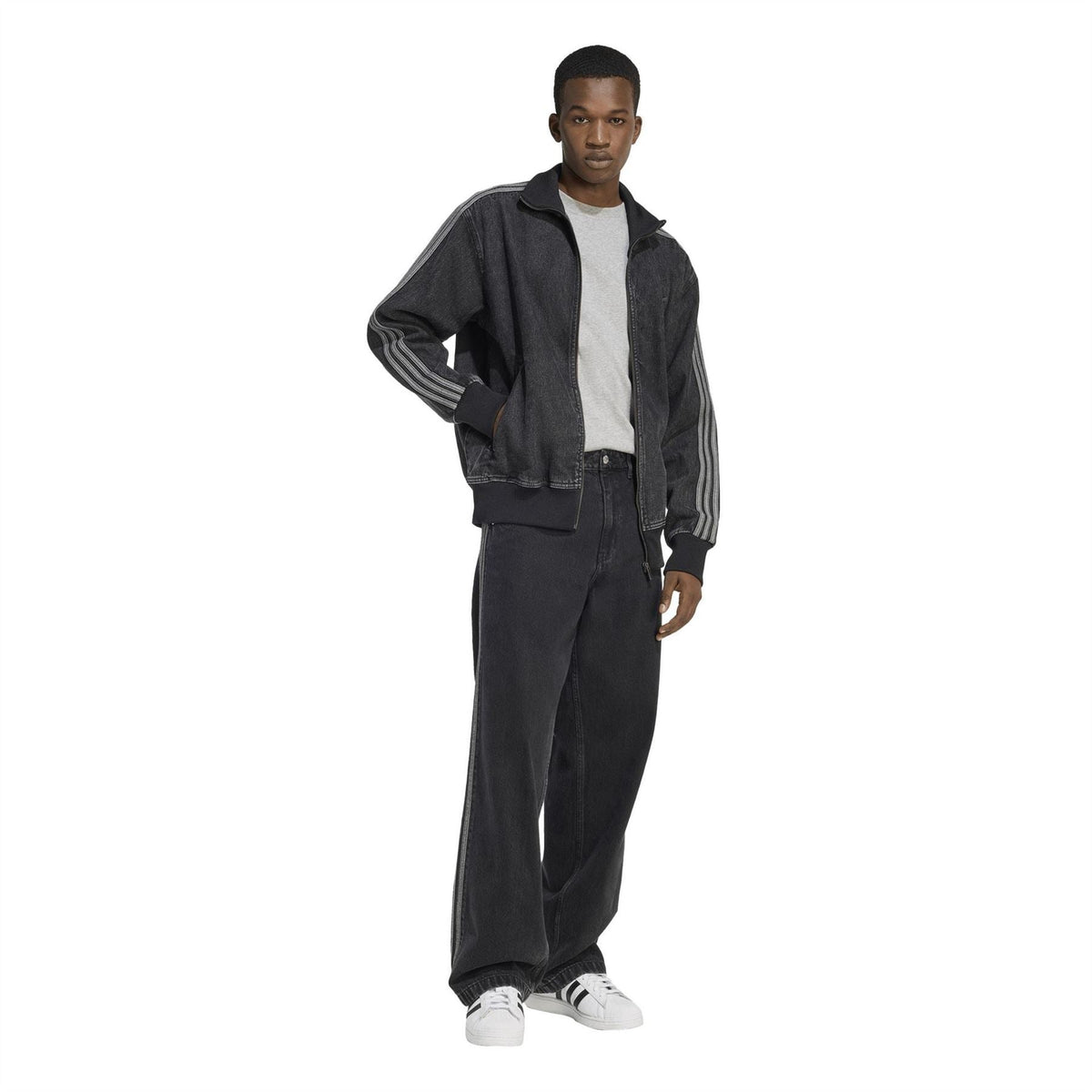 Mens black denim jacket with side stripes on sleeves, zip front, and high collar