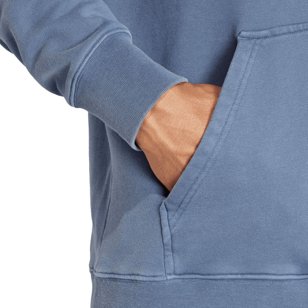 Blue hoodie close-up of sleeve and kangaroo pocket seam details
