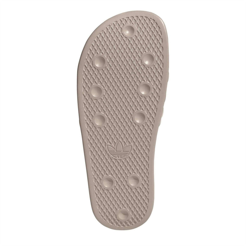 adidas taupe slide sandals outsole with grip dots and adidas trefoil logo