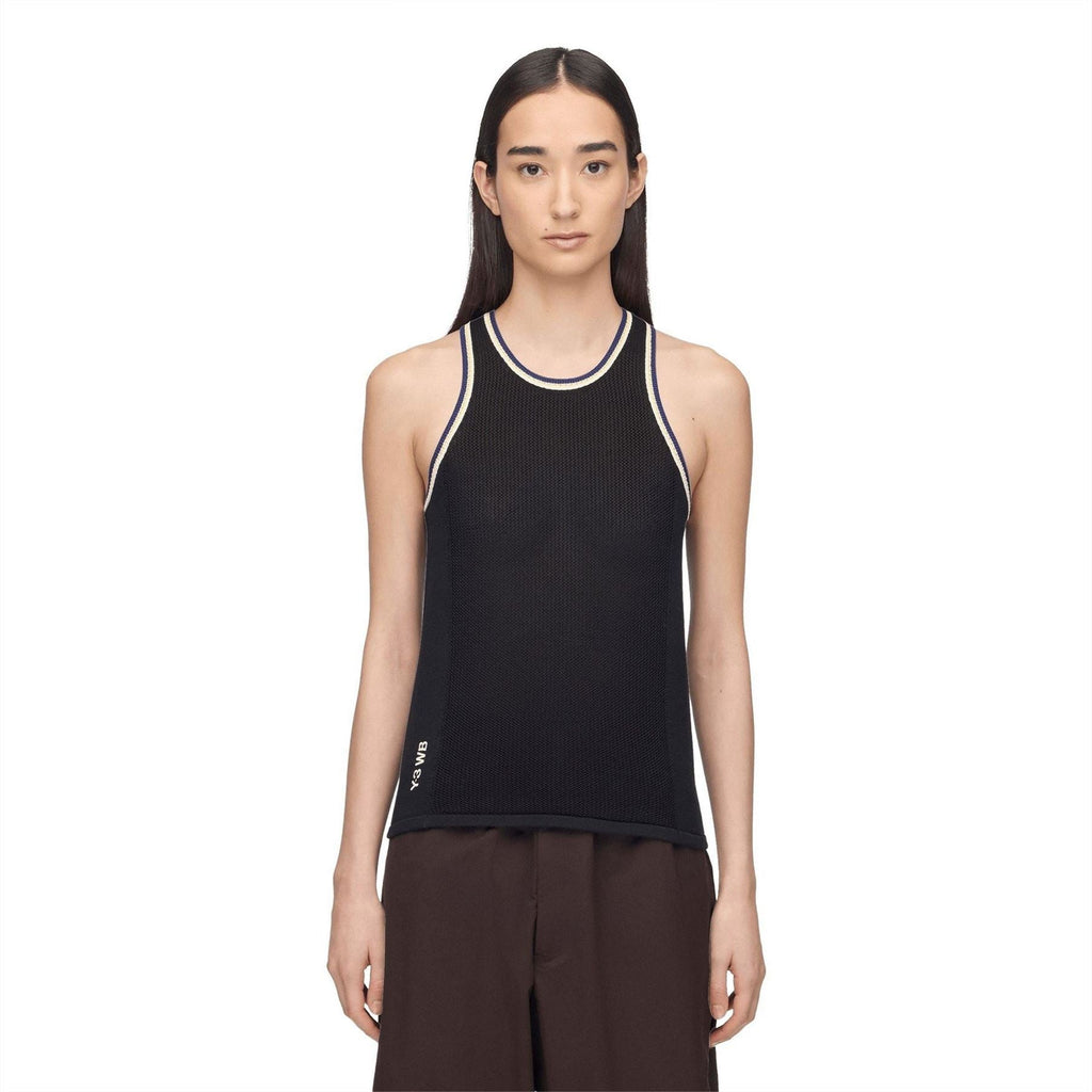 Black knit tank top with crew neck and contrast trim, worn by model