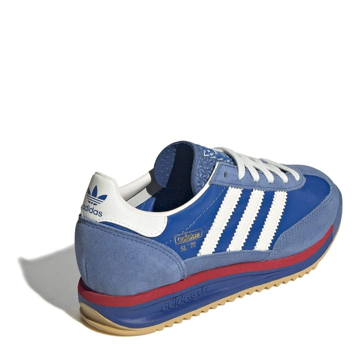 Blue suede low-top sneakers with white stripes, red side trim, gum outsole
