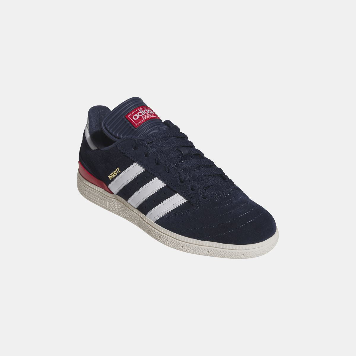 Navy Busenitz sneakers with collar strap, white stripes, and red midsole edge