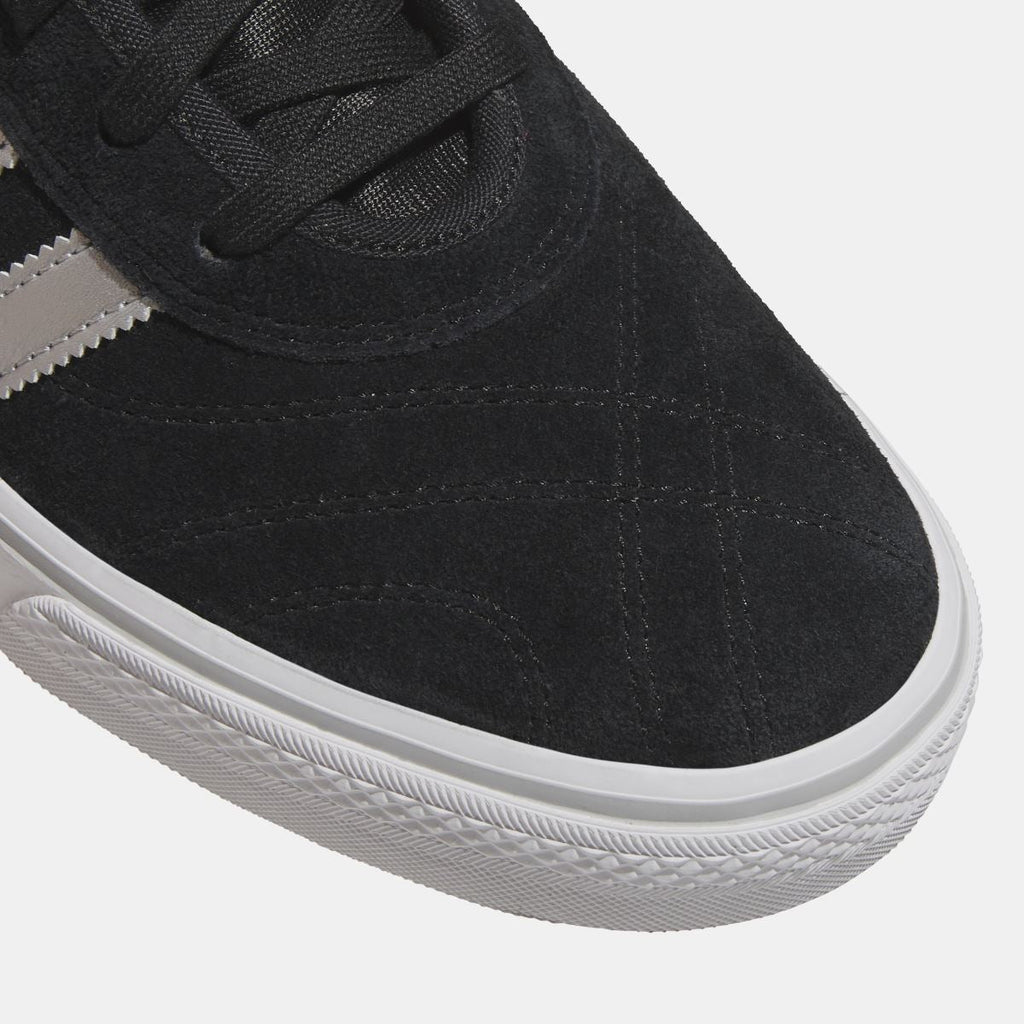 Close-up of adidas Originals Adi Ease black suede upper with white sidewall midsole