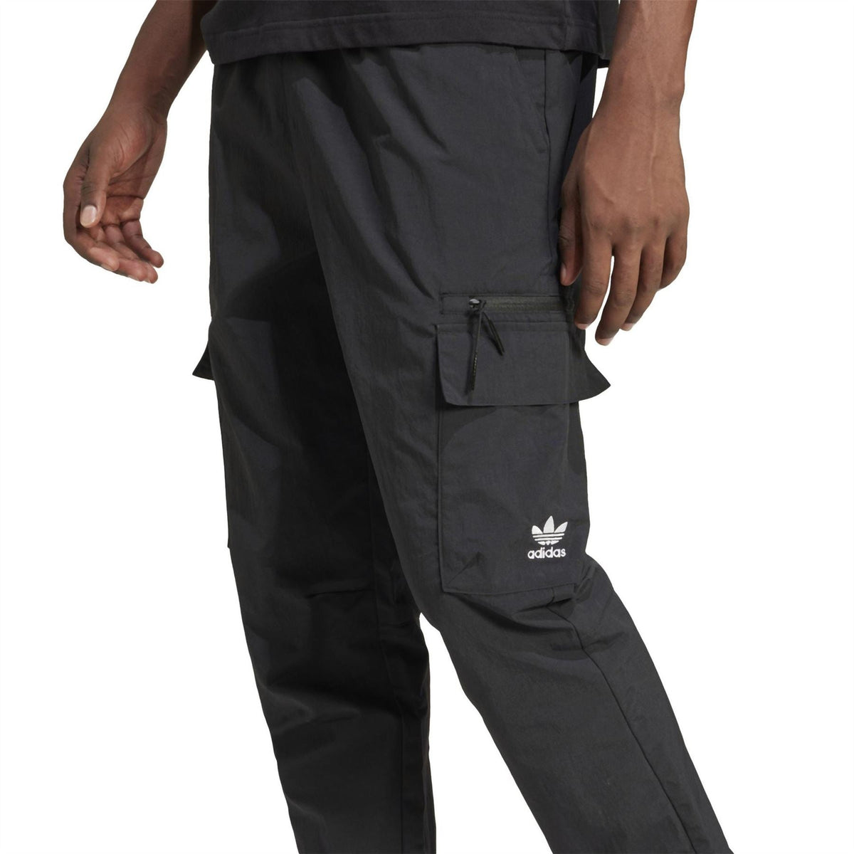 Black cargo pants with front drawstring waist, flap pockets, and adidas logo