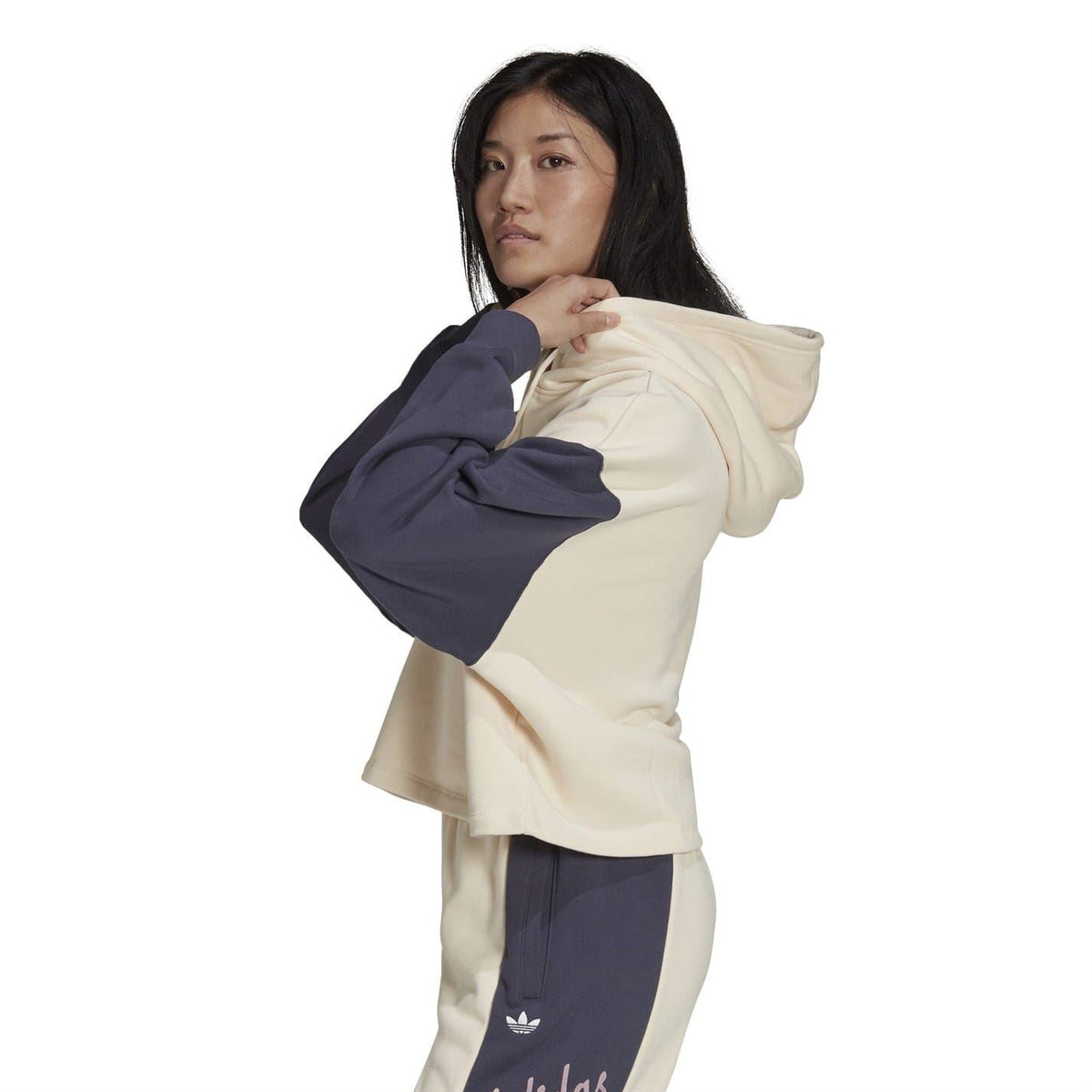Cropped hooded sweatshirt with cream body, navy sleeves, drawstring hood and kangaroo pocket
