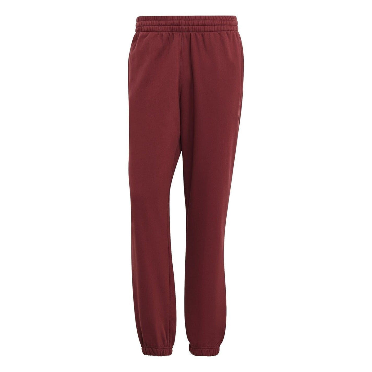 Burgundy adidas Originals jogger pants with elastic waistband and cuffed hem