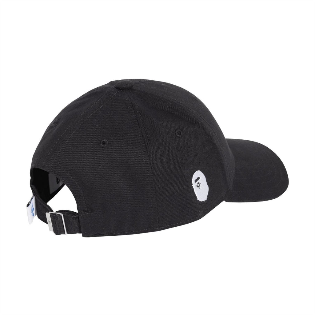 Black ball cap with adjustable strap and small side logo patch