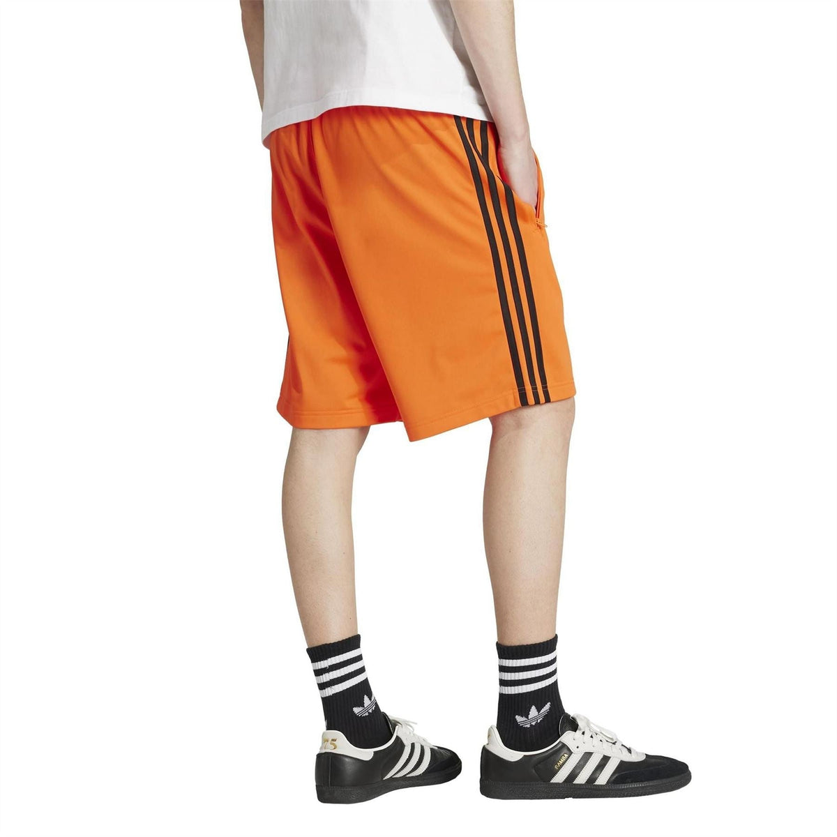 adidas Originals Adicolor Firebird Shorts in vibrant color with elastic waistband and sporty design, shown on a hanger.