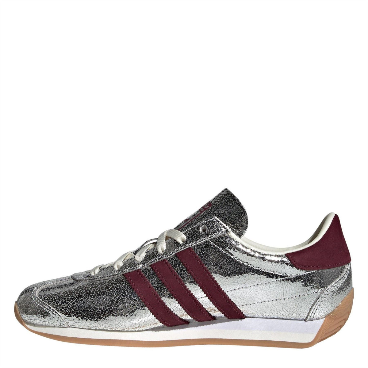 adidas Originals Country OG TR footwear showing classic low-top design, tan suede upper, and retro style sneakers.