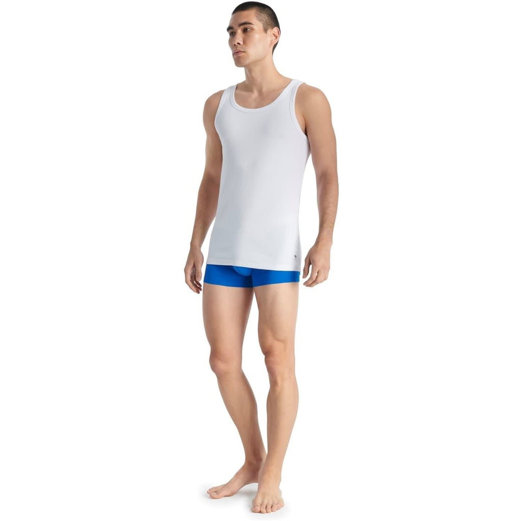 White sleeveless tank top with scoop neckline and small logo at lower right hem