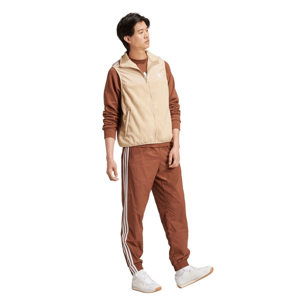 adidas Originals beige microfleece vest with front zipper and high collar, worn look