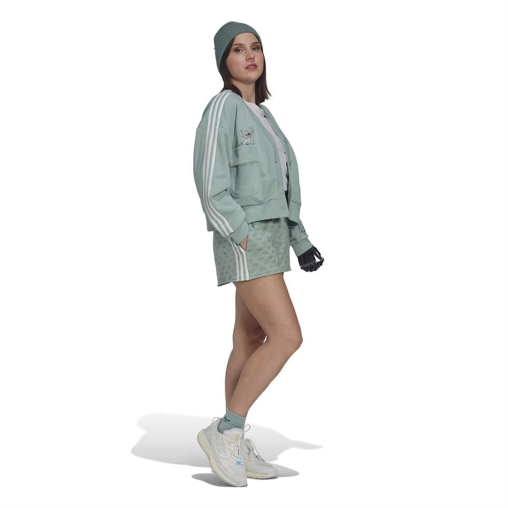 Mint green shorts hem with adidas logo and Disney graphic; allover leaf and character print