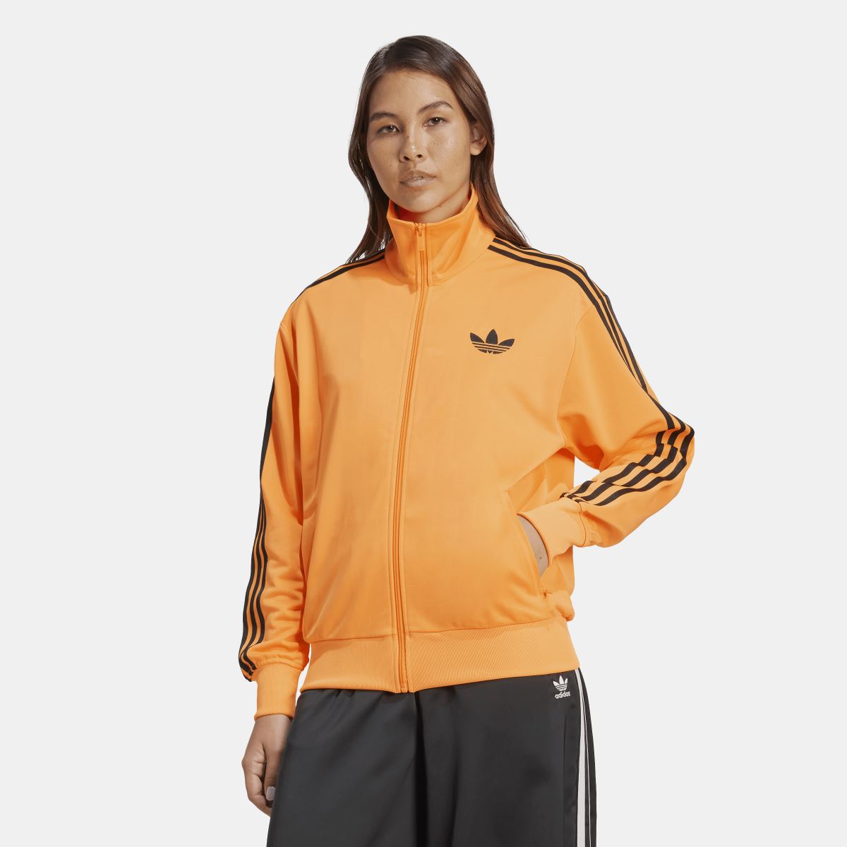 Orange track top with stand collar, full zip, black adidas stripes on sleeves