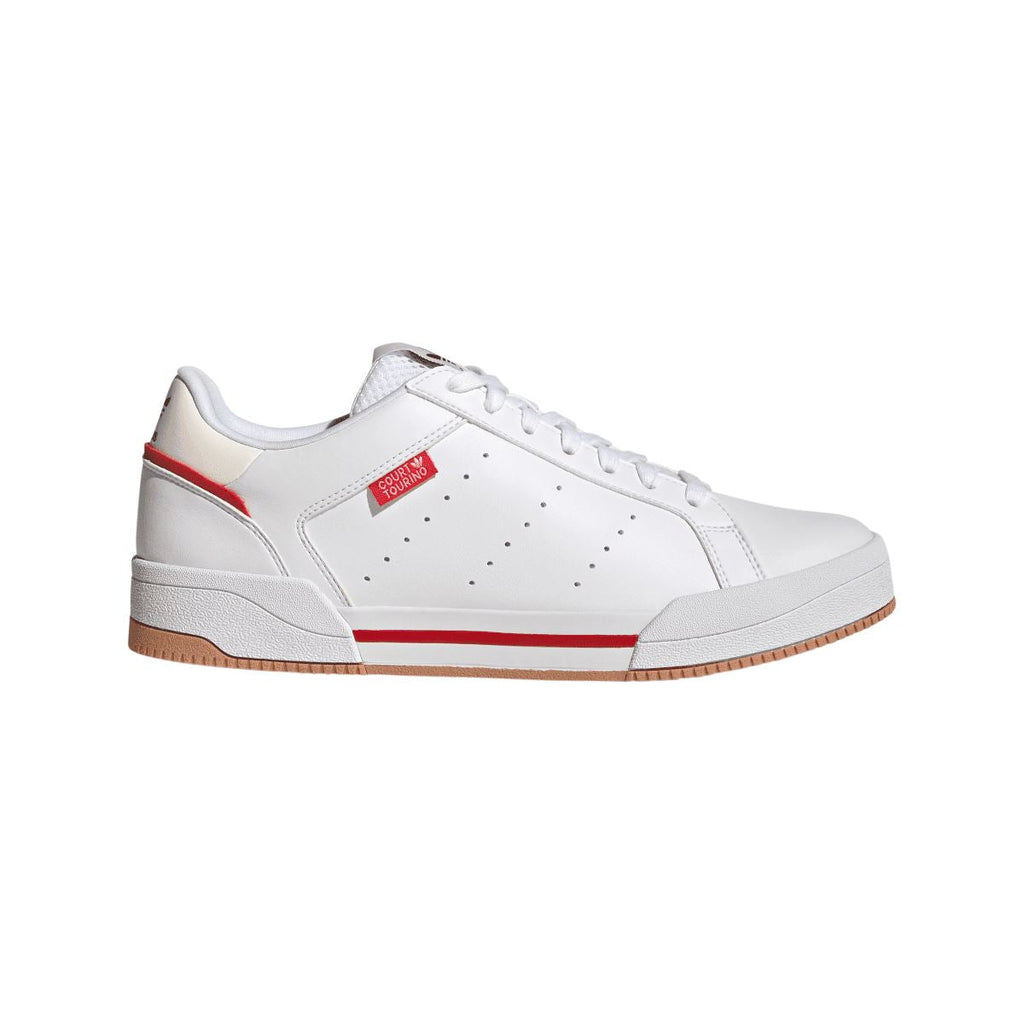 White low-top trainers with red stripe and gum rubber sole