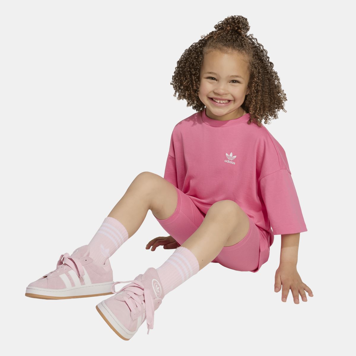 Infants pink adidas T-shirt and cycling shorts set while kneeling, logo on chest