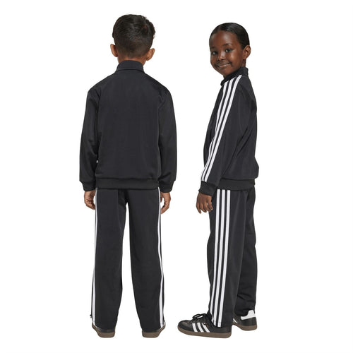 Kids adidas Firebird tracksuit, back view, black with white stripes on zip jacket and pants