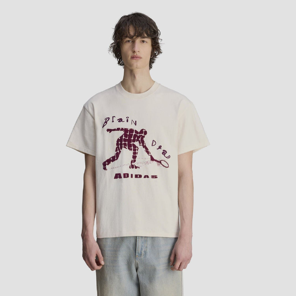 Cream crew-neck T-shirt with purple robot graphic and 'ADIDAS' lettering