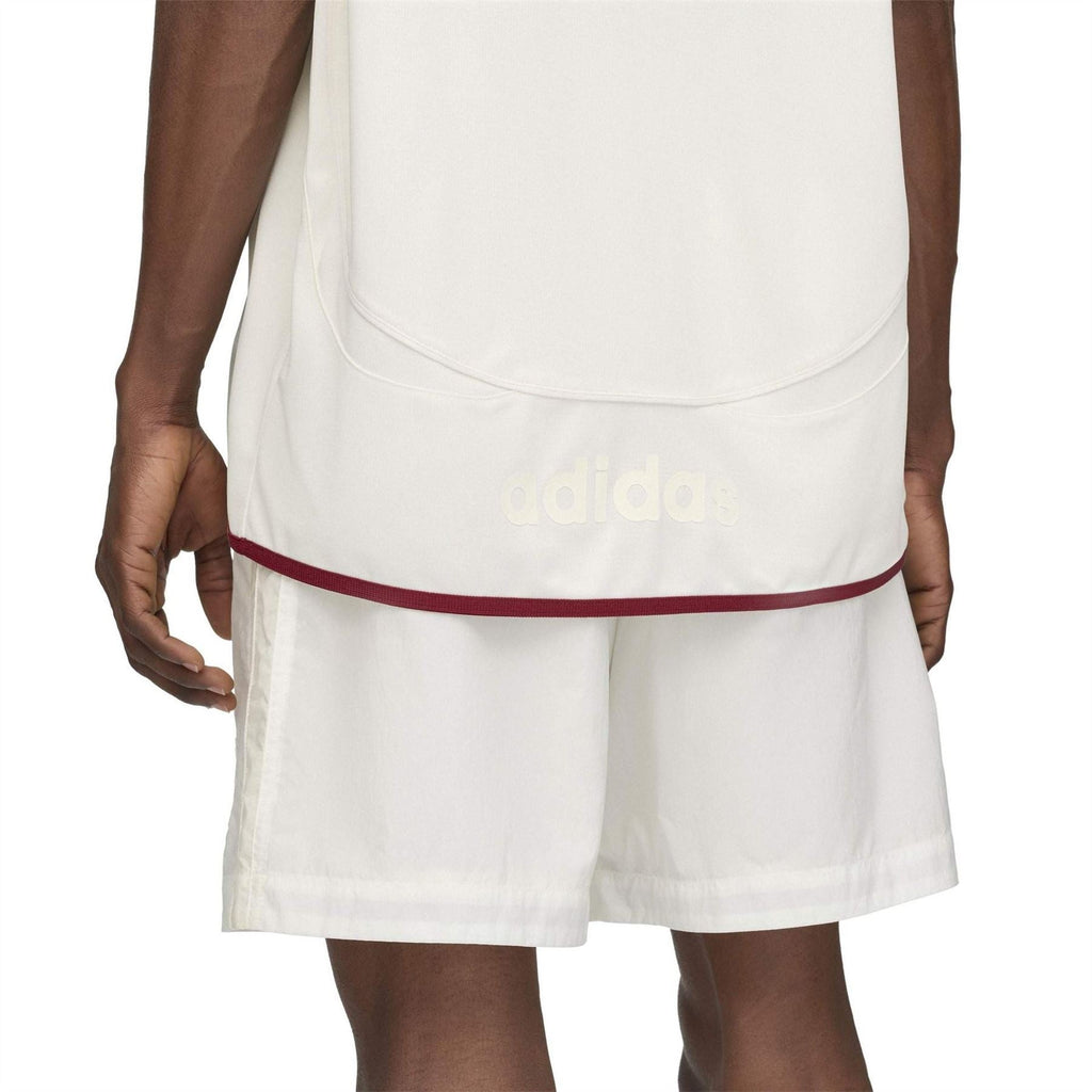 White football jersey hem close-up with burgundy contrast trim and adidas logo
