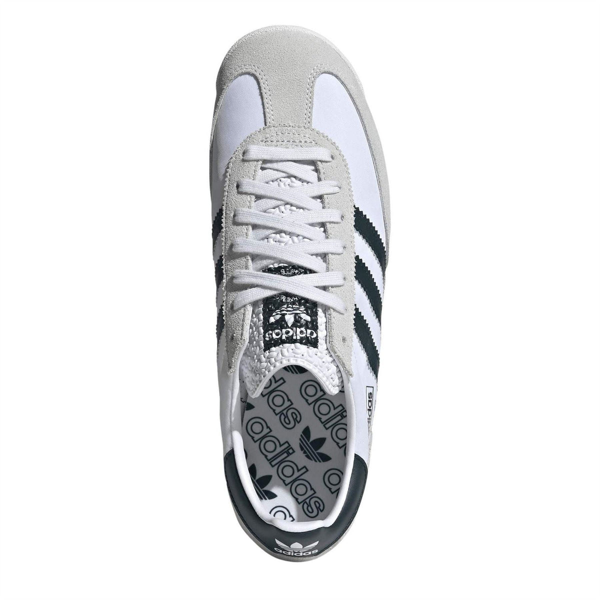 Shoe toe and lace-up front with white laces and black three-stripe detailing
