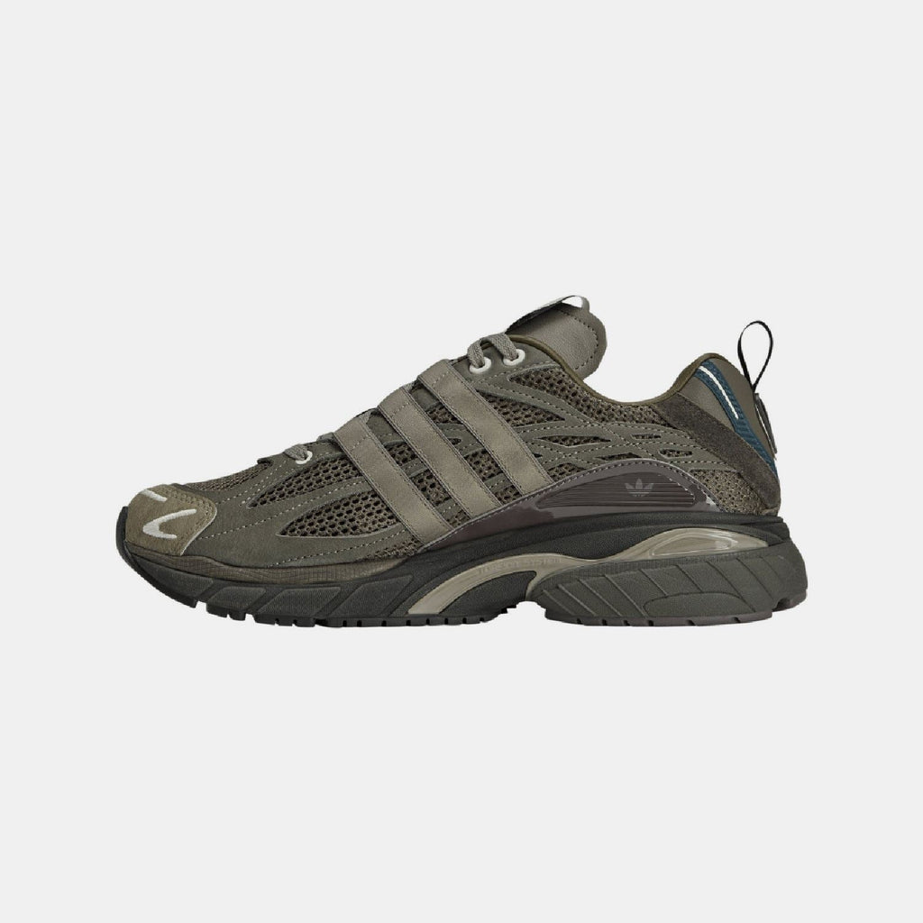 Cushion STFM trainers side profile in olive-brown with striped overlays and chunky sole