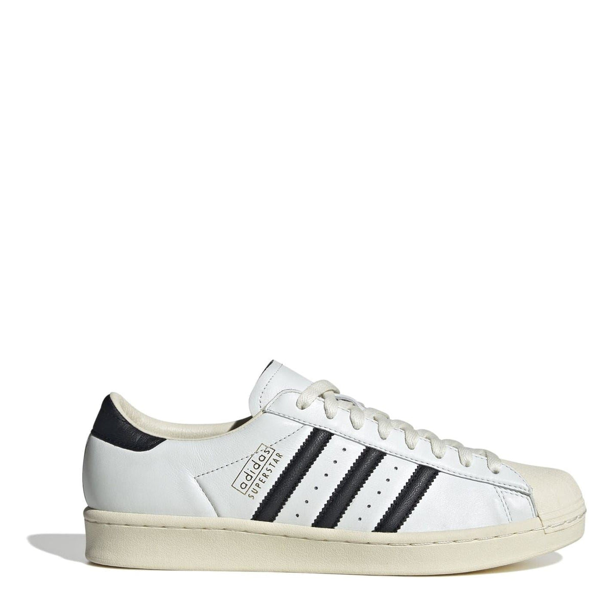 White low-top sneakers with black three-stripe panels, lace-up, shell toe