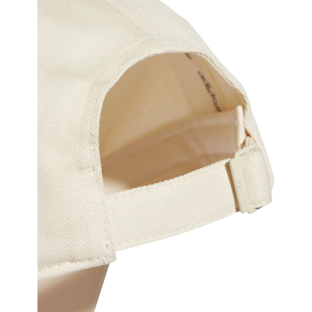 Light beige dad cap interior with adjustable fabric strap and curved opening