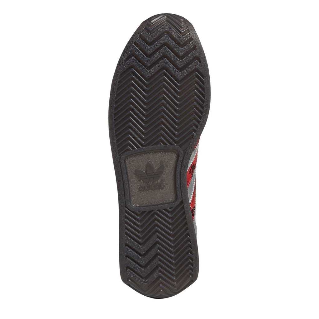 Rubber outsole of silver adidas Originals sneaker with zigzag tread