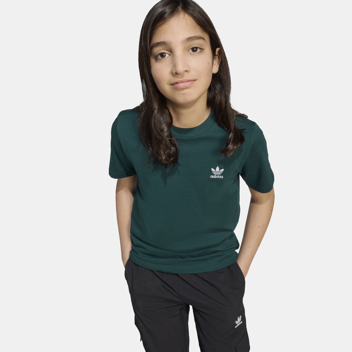 Junior adidas Originals T-shirt for ages 8-16, featuring classic brand logo and comfortable casual fit, shown in the image.