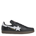 Black low-top canvas sneakers with white star logo and black lace-up design